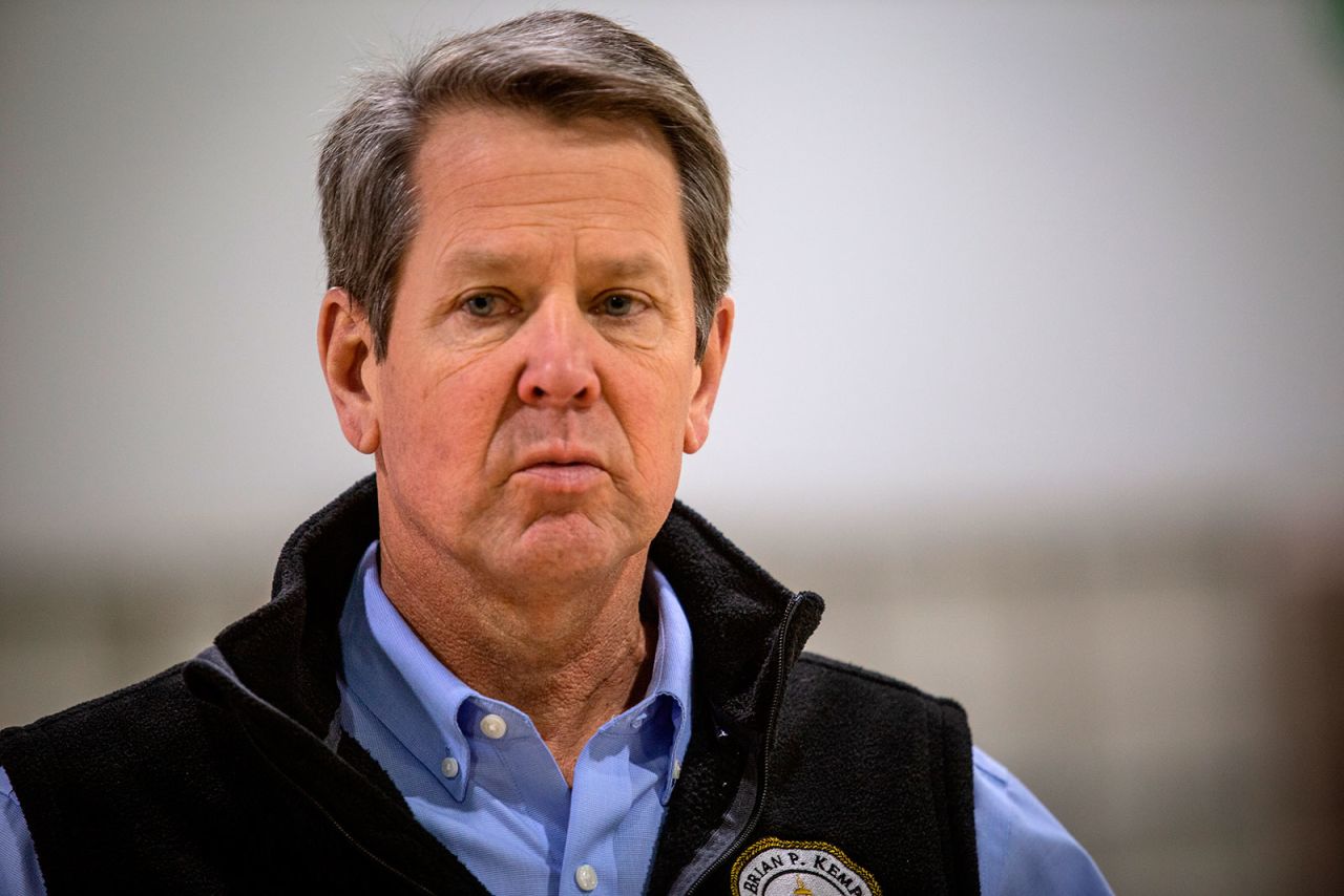 Georgia Gov. Brian Kemp listens to a question from the media at the Georgia World Congress Center in Atlanta on April 16. 