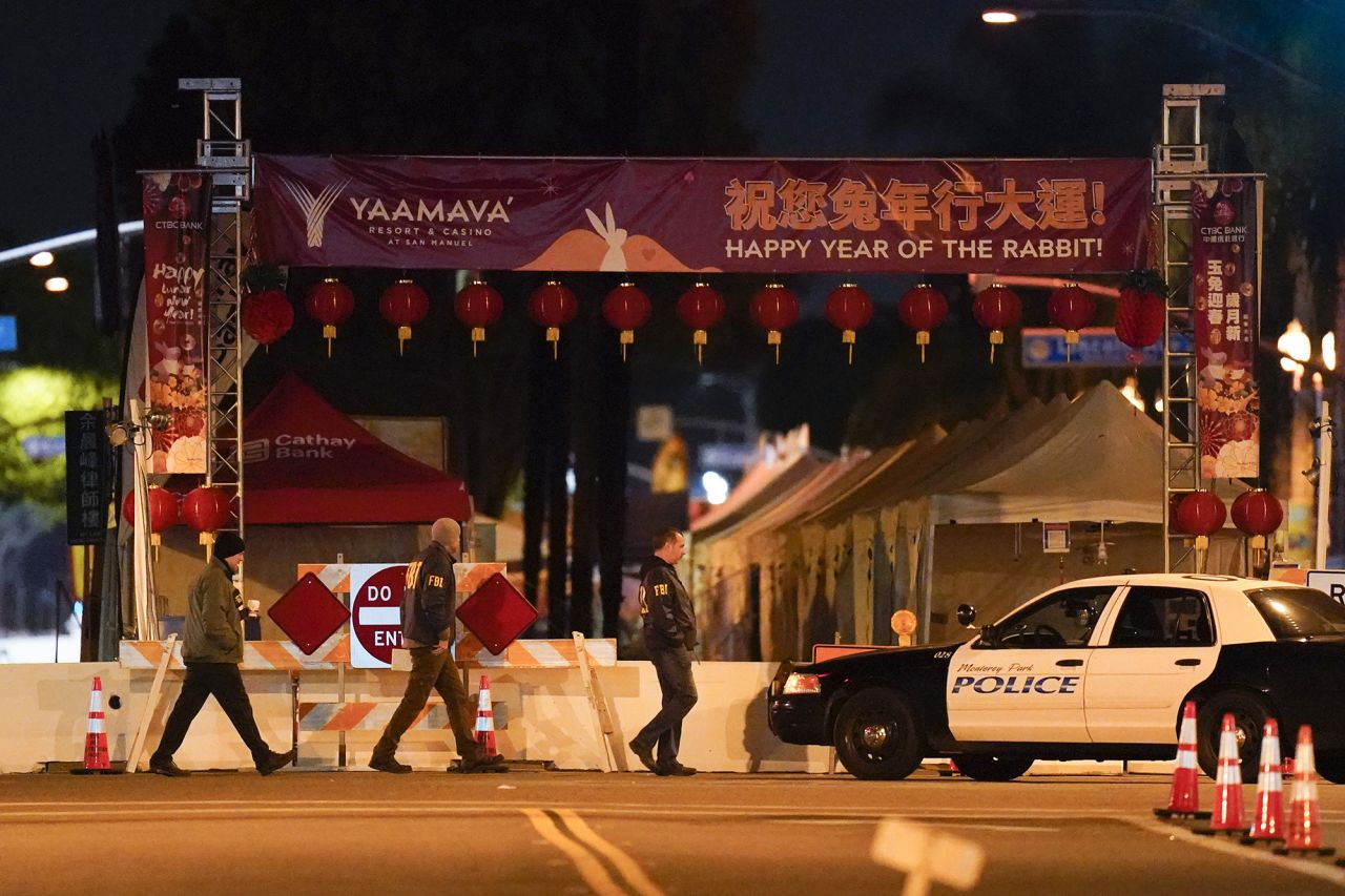 FBI agents and police near the scene of the shooting in Monterey Park early Sunday. 