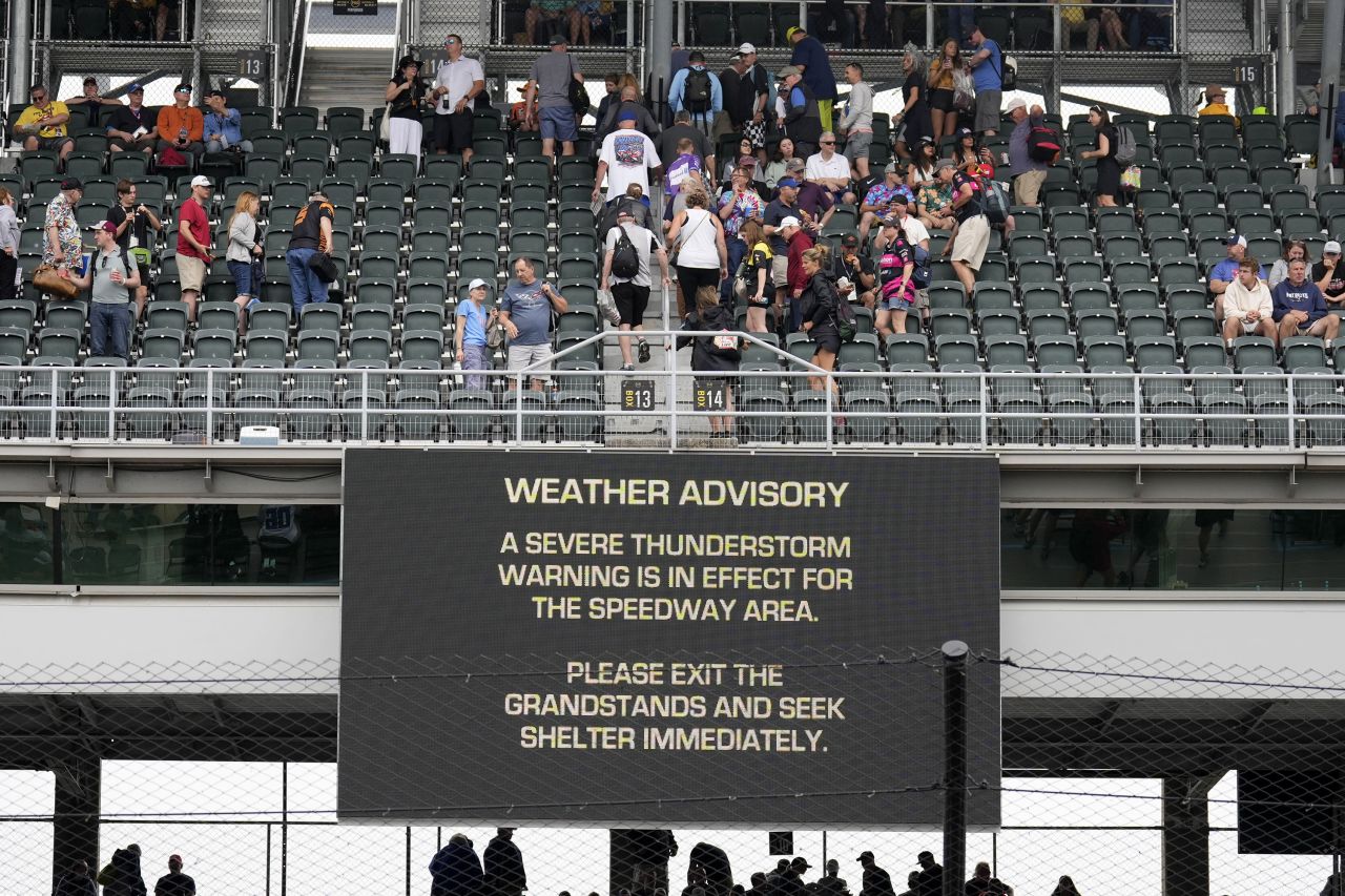 Fans exit the grandstands after a serve thunderstorm warning was issued at the Indianapolis Motor Speedway in Indiana on May 26.