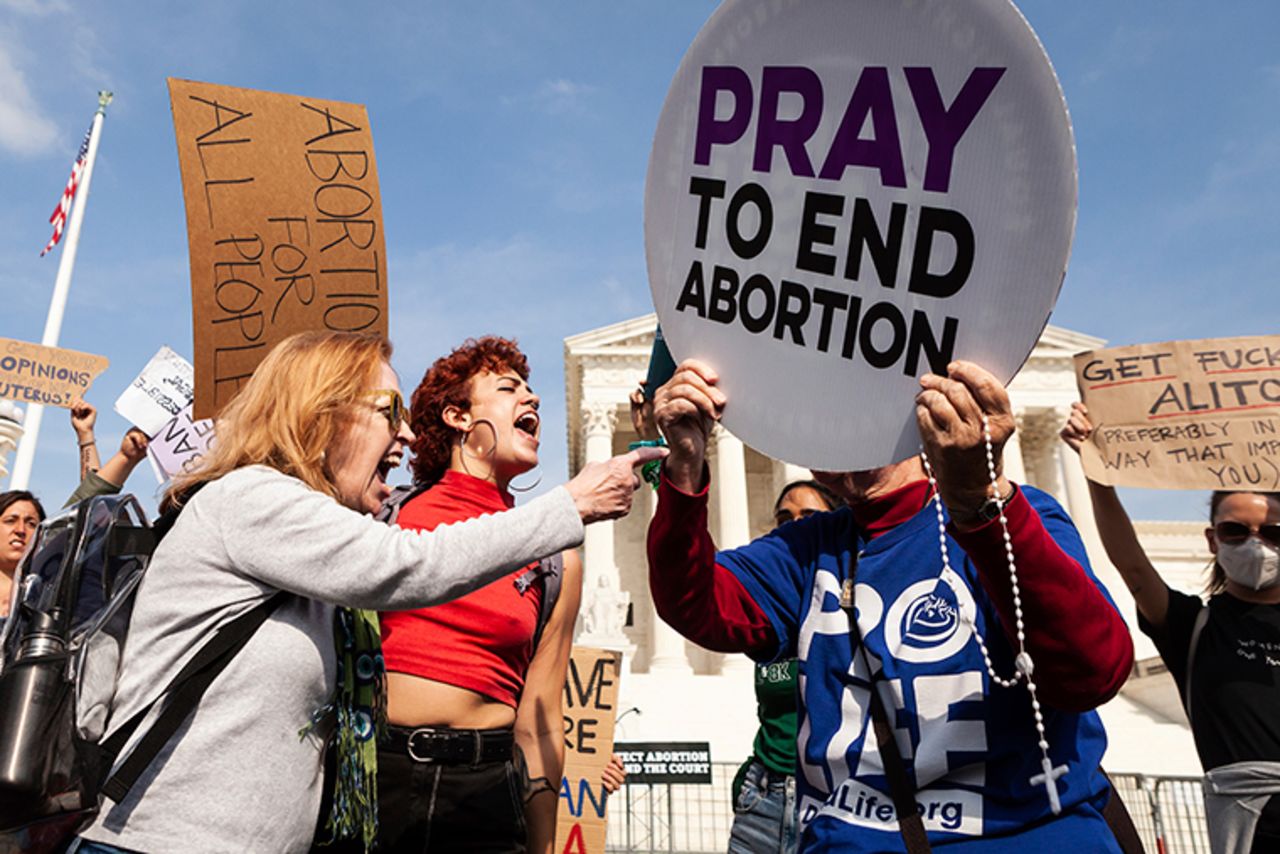  Hundreds of pro-abortion and anti-abortion protestors gather outside the Supreme Court. 