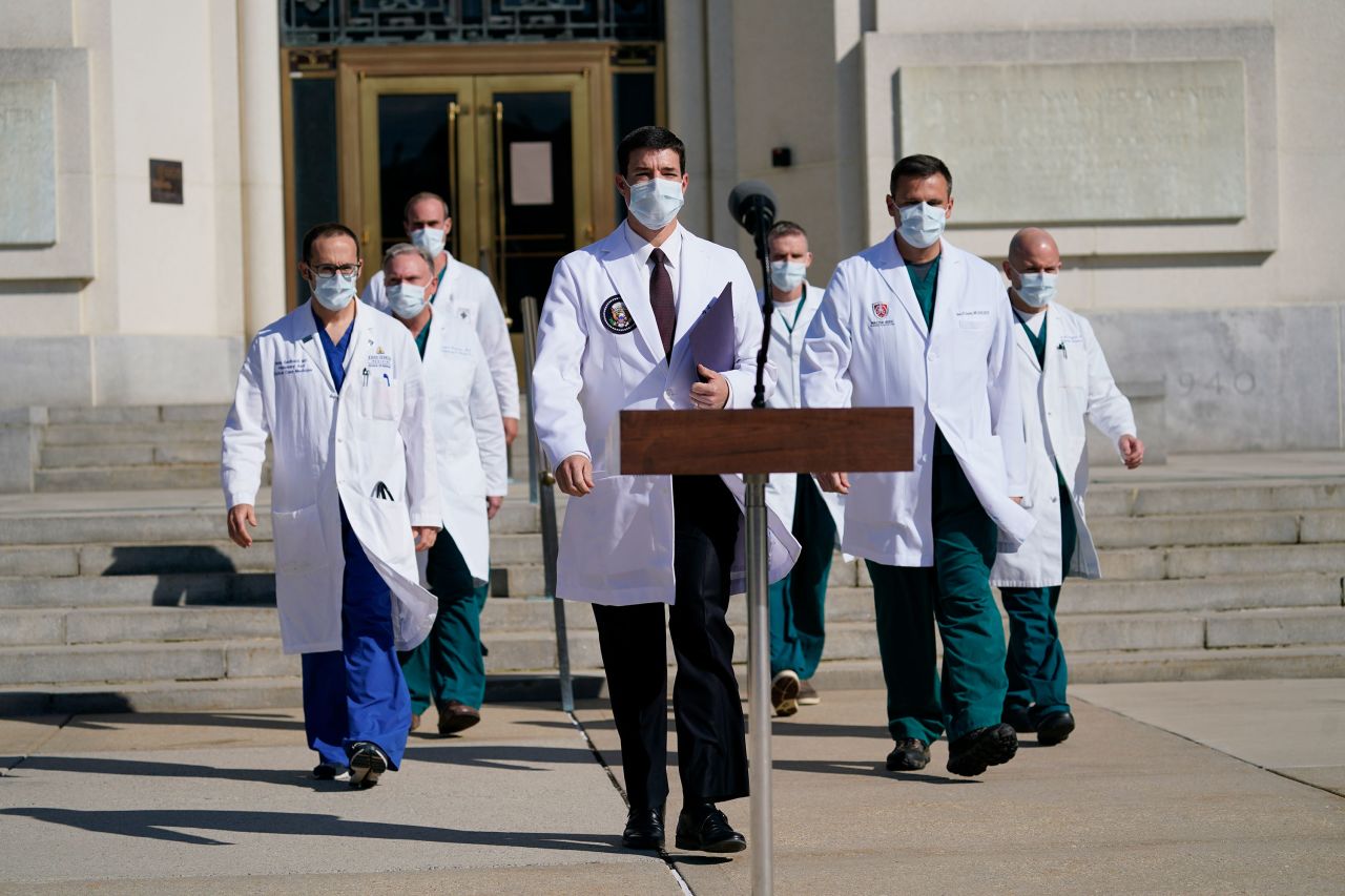 President Trump's physician Dr. Sean Conley, center, and other doctors attend a press conference at Walter Reed National Military Medical Center on October 5 in Bethesda, Maryland.