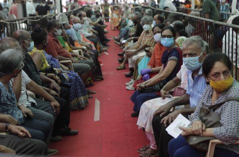 People wait to receive a Covid-19 vaccine in Mumbai, India, on Thursday, April 29. 