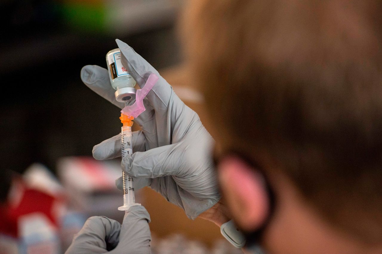 Pharmacist Jef Bratberg draws the Moderna Vaccine into syringes at Central Falls High School in Central Falls, Rhode Island, on February 13.