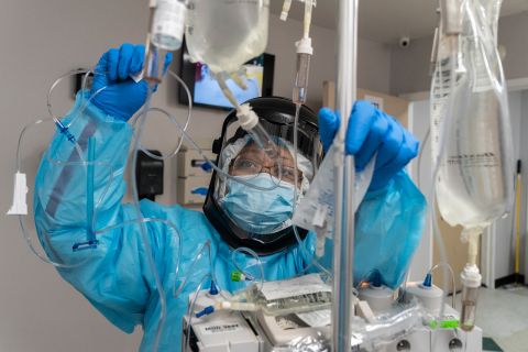 A medical staff member checks the IV drip for a patient in the Covid-19 intensive care unit during Thanksgiving at the United Memorial Medical Center on Nov. 26, in Houston, Texas. 