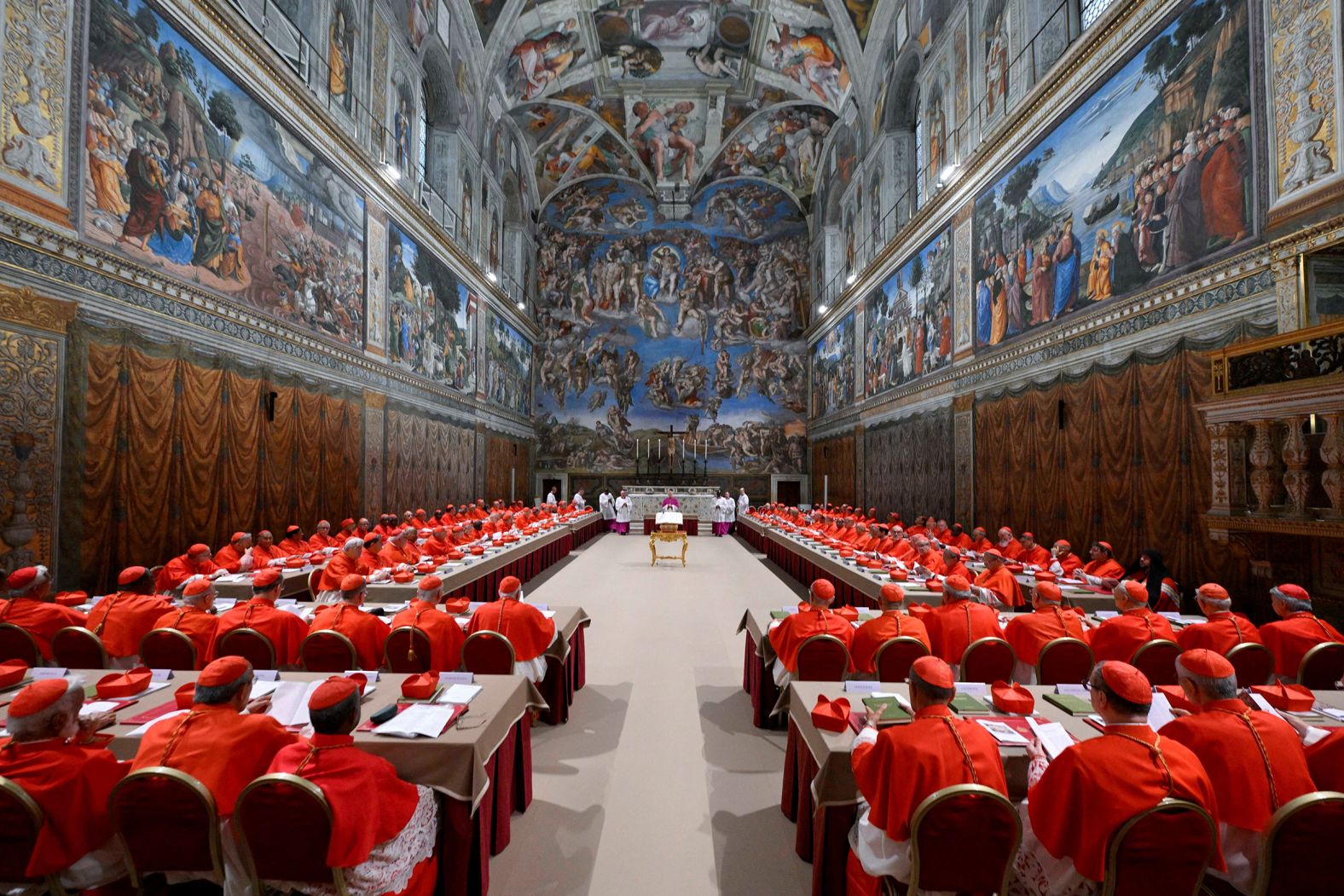 Cardinals pray in the Sistine Chapel before the start of the papal conclave on Wednesday, May 7.