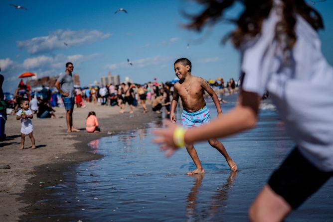 Children enjoy Coney Island Beach in New York on Monday, May 26. <a  target="_top" href="/newspapers?url=https://www.cnn.com/2025/05/22/world/gallery/photos-this-week-may-15-may-22">See last week in 35 photos</a>.