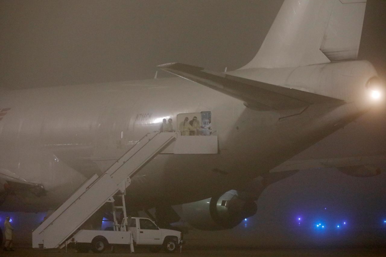 Officials board the Kalitta Air flight carrying American evacuees from the Diamond Princess cruise ship at Joint Base San Antonio-Lackland on February 17 in San Antonio, Texas.?