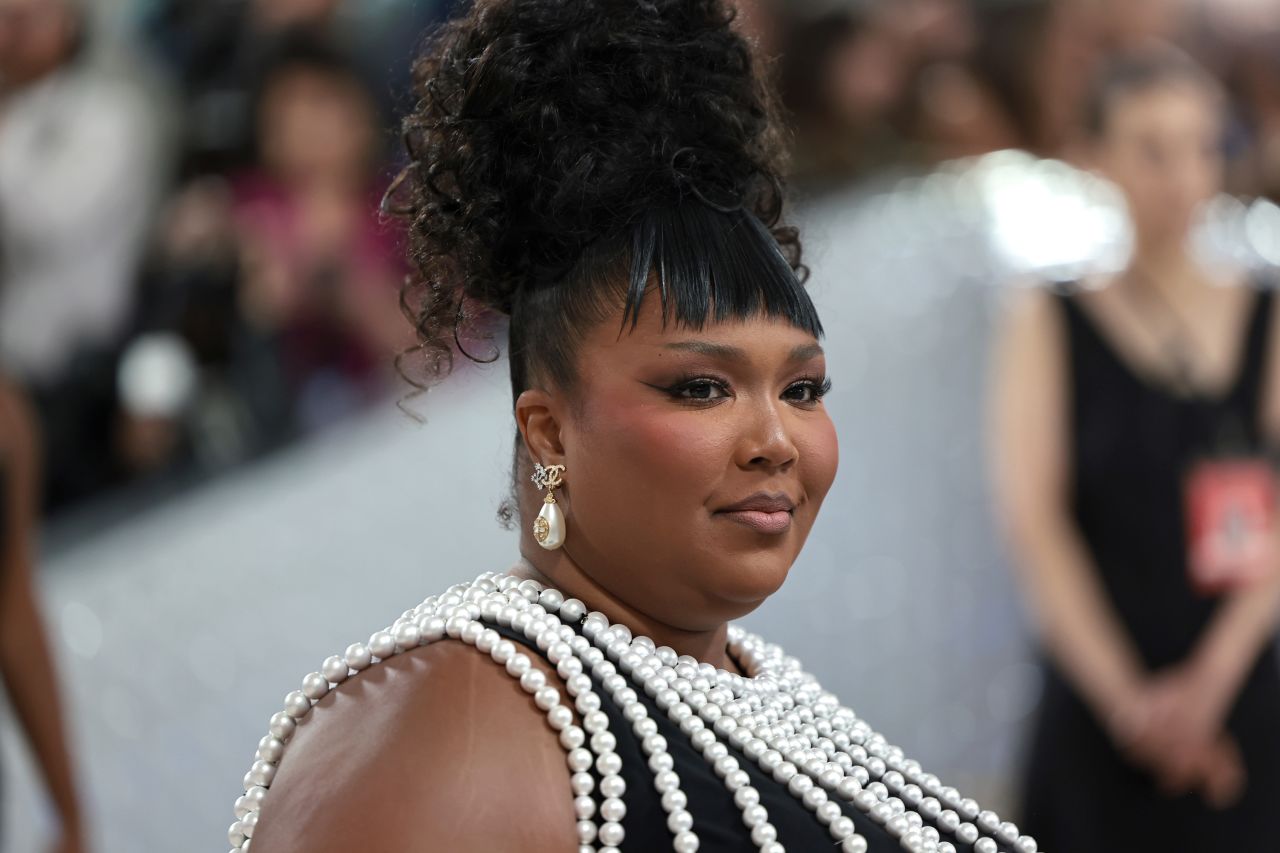 Lizzo's look also gave a nod to the late designer's love of pearls.