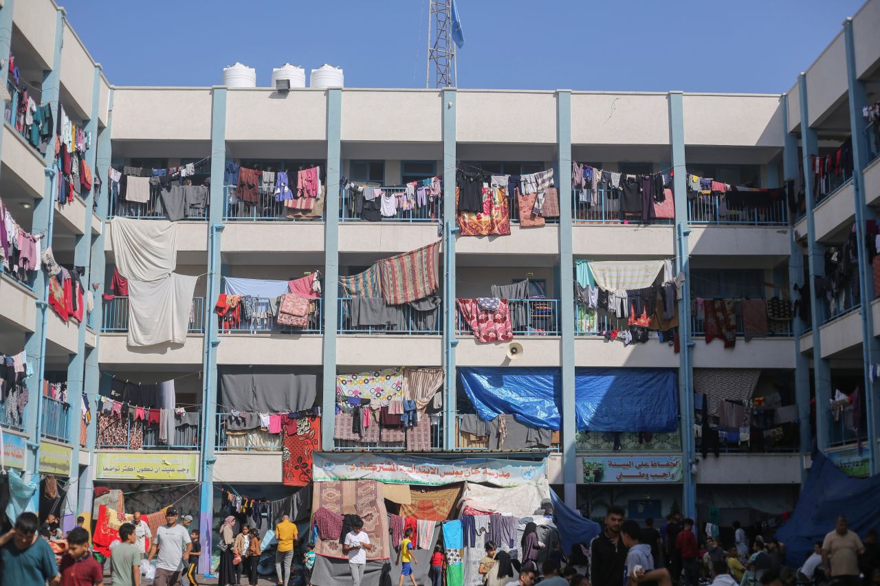 Displaced people are seen in the yard of a United Nations school housing in Khan Yunis on November 4.