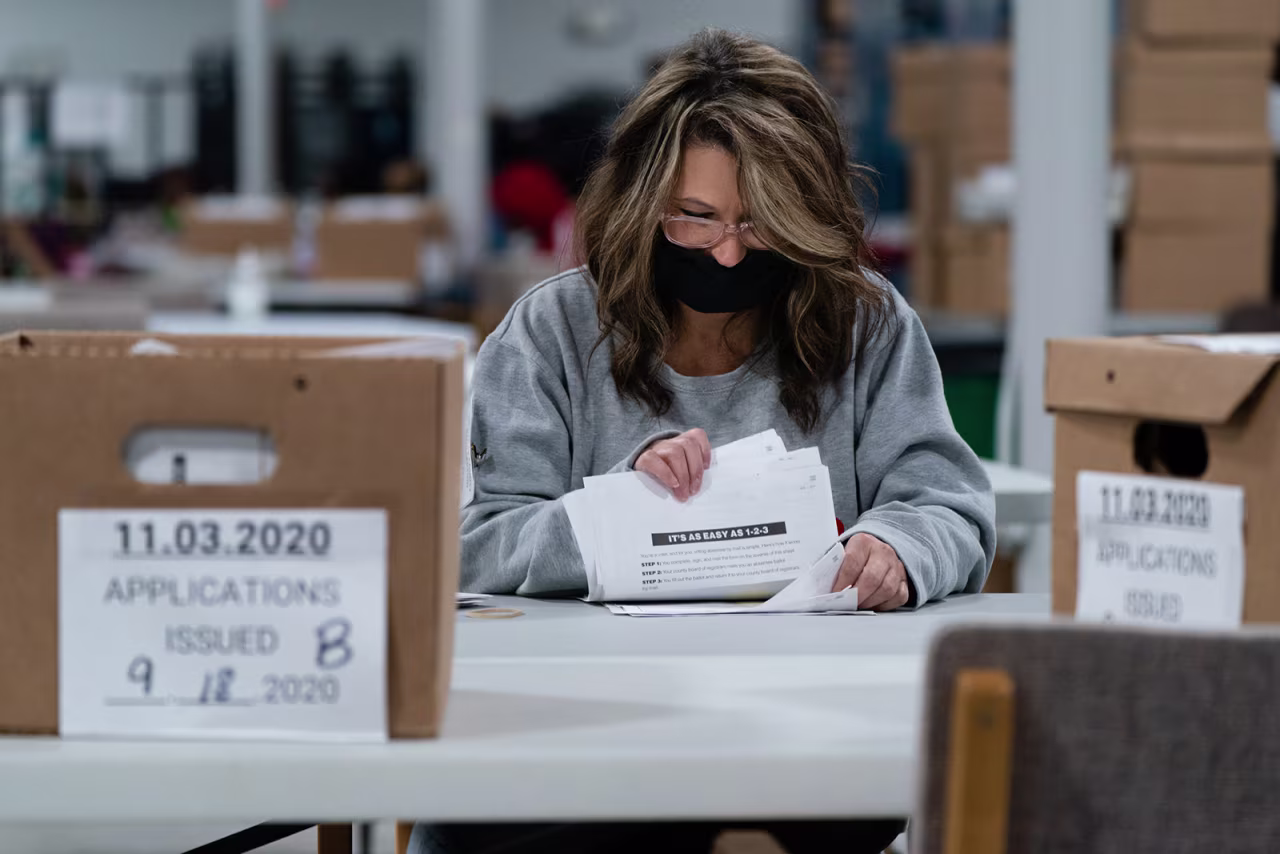 Election personnel check in provisional ballots at the Gwinnett County Board of Voter Registrations and Elections offices in Lawrenceville, Georgia, on November 7.
