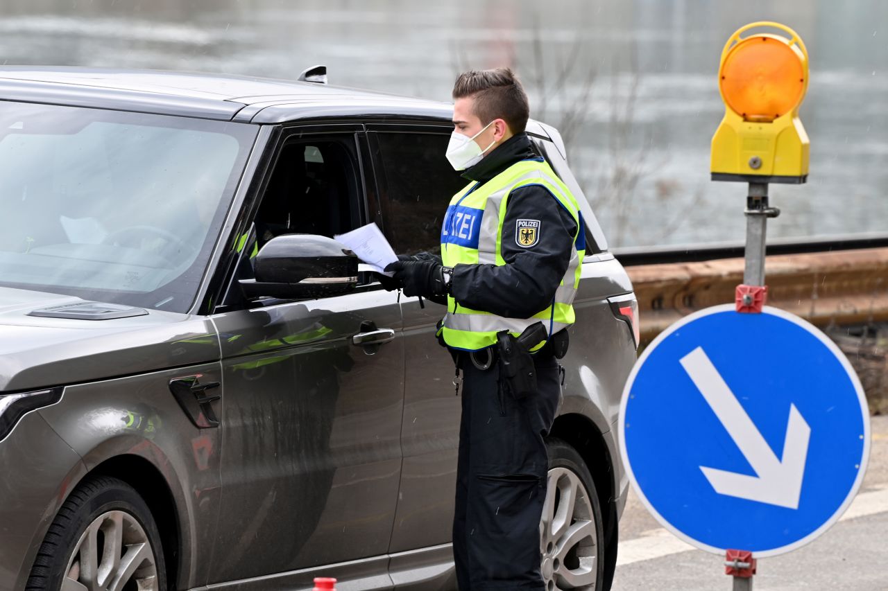 A German Federal Police officer checks a driver arriving from Austria at the border between Kufstein, Austria, and Kiefersfelden, Germany, on February 9.