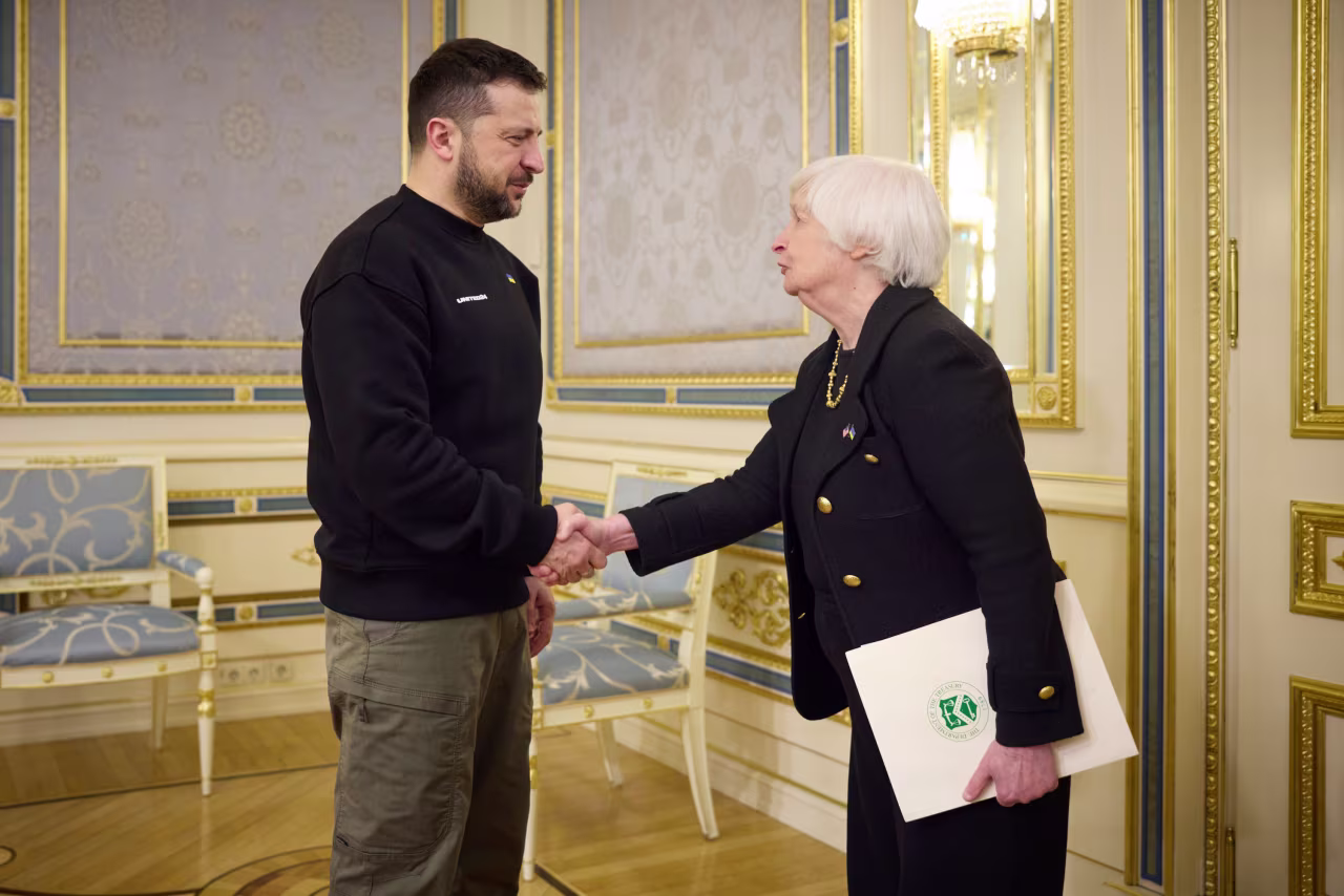 Ukrainian President Volodymyr Zelensky and US Treasury Secretary Janet Yellen shake hands during their meeting in Kyiv, Ukraine, on Monday.