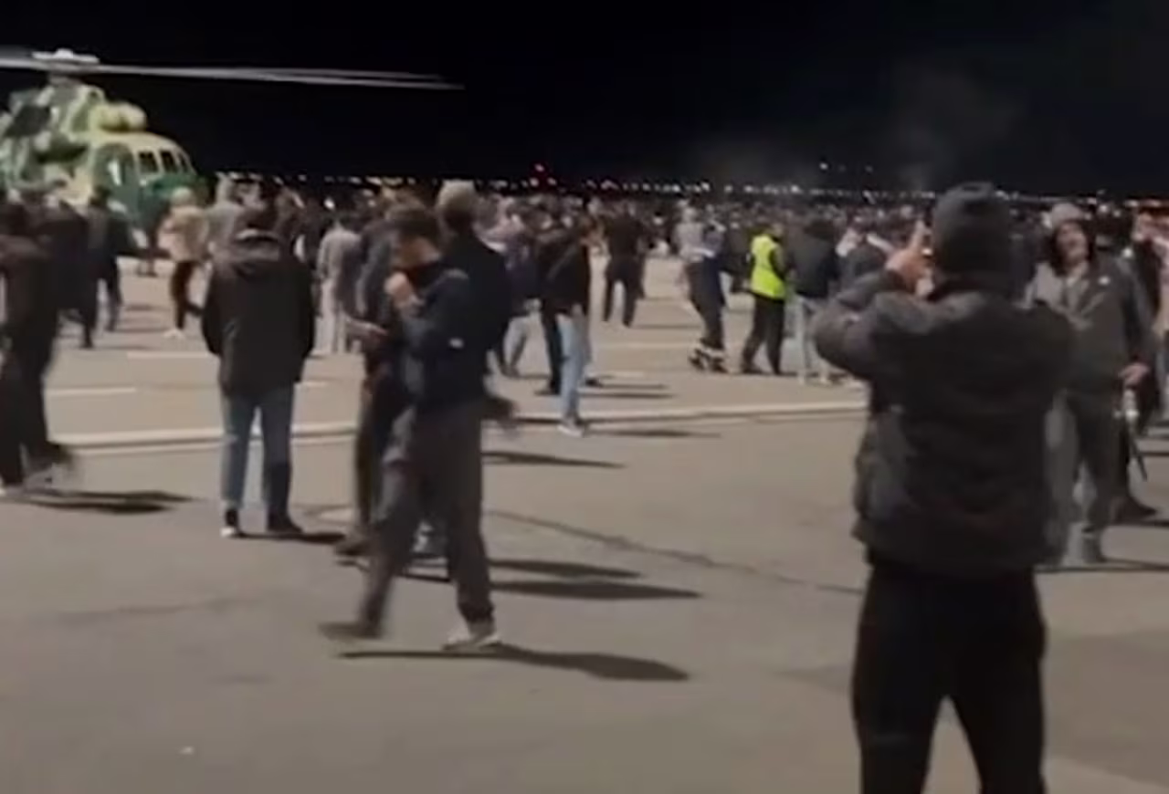 People crowd the tarmac at Makhachkala Uytash Airport in the southern Russian Republic of Dagestan on October 29. 