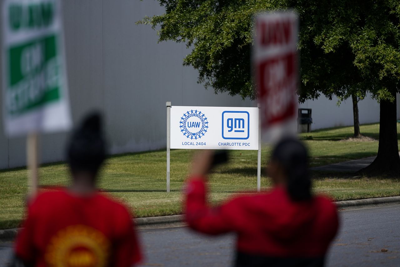 United Auto Workers members and supporters picket outside a General Motors facility on Friday, Sept. 22 in Charlotte, N.C. The United Auto Workers expanded its strike against major automakers Friday, walking out of 38 General Motors and Stellantis parts distribution centers in 20 states. 