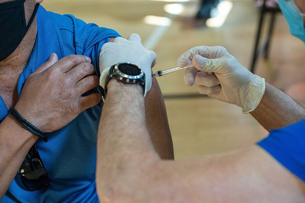 A nurse?inoculates a person with the second Moderna Covid-19 vaccine dose at a mobile Covid-19 vaccination clinic in Bridgeport, Connecticut on April 20, 2021.?