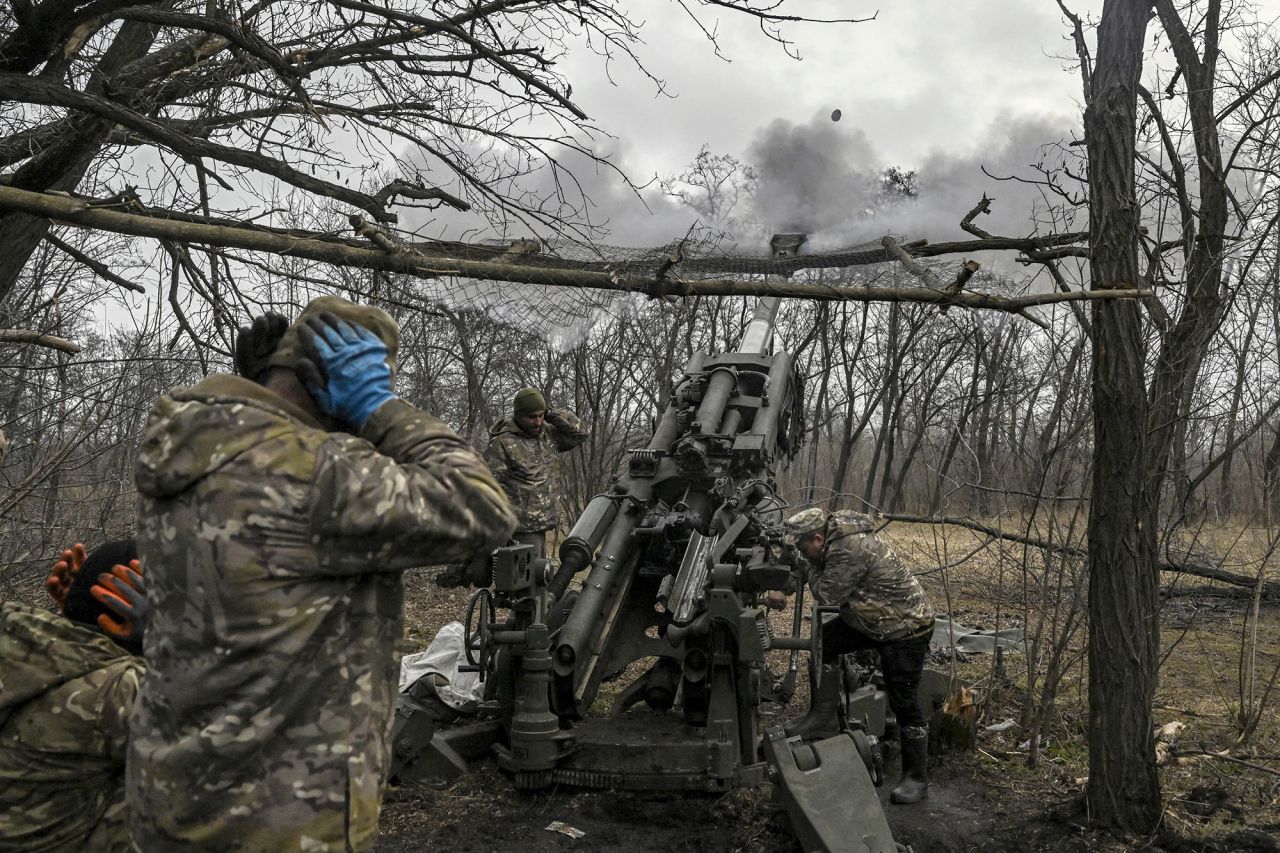 Ukrainian servicemen fire towards Russian positions on the front line near the city of Bakhmut, Ukraine, on March 11.