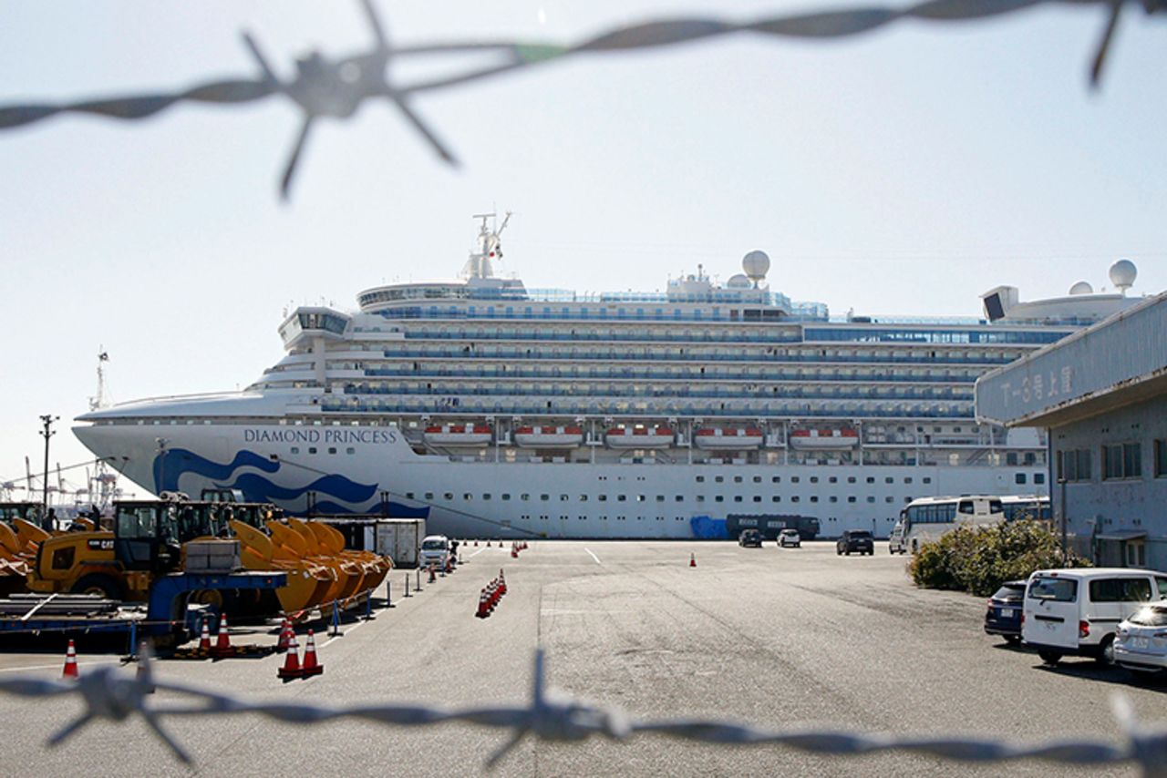 The quarantined ship Diamond Princess is pictured through barbed wire at Yokohama port in Yokohama, near Tokyo Monday, February 17.