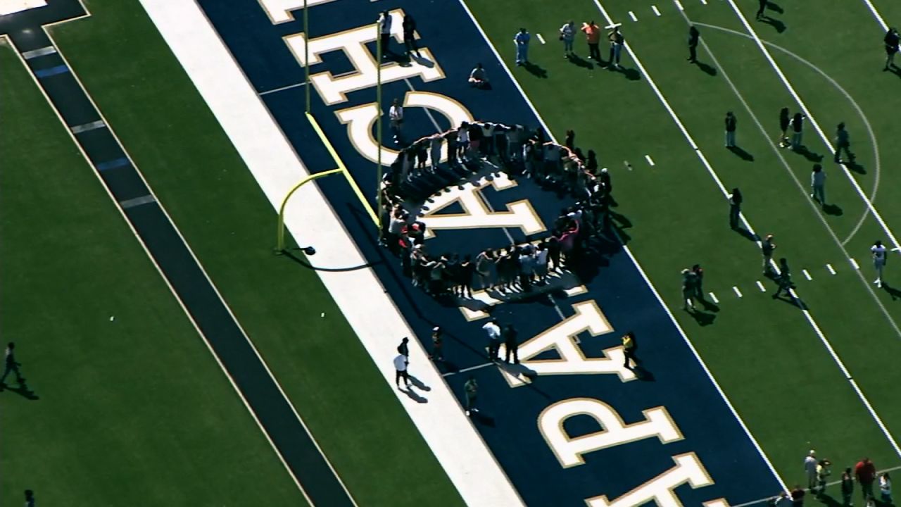 Students gather on the Apalachee High School football field following the shooting on September 4 in Winder.