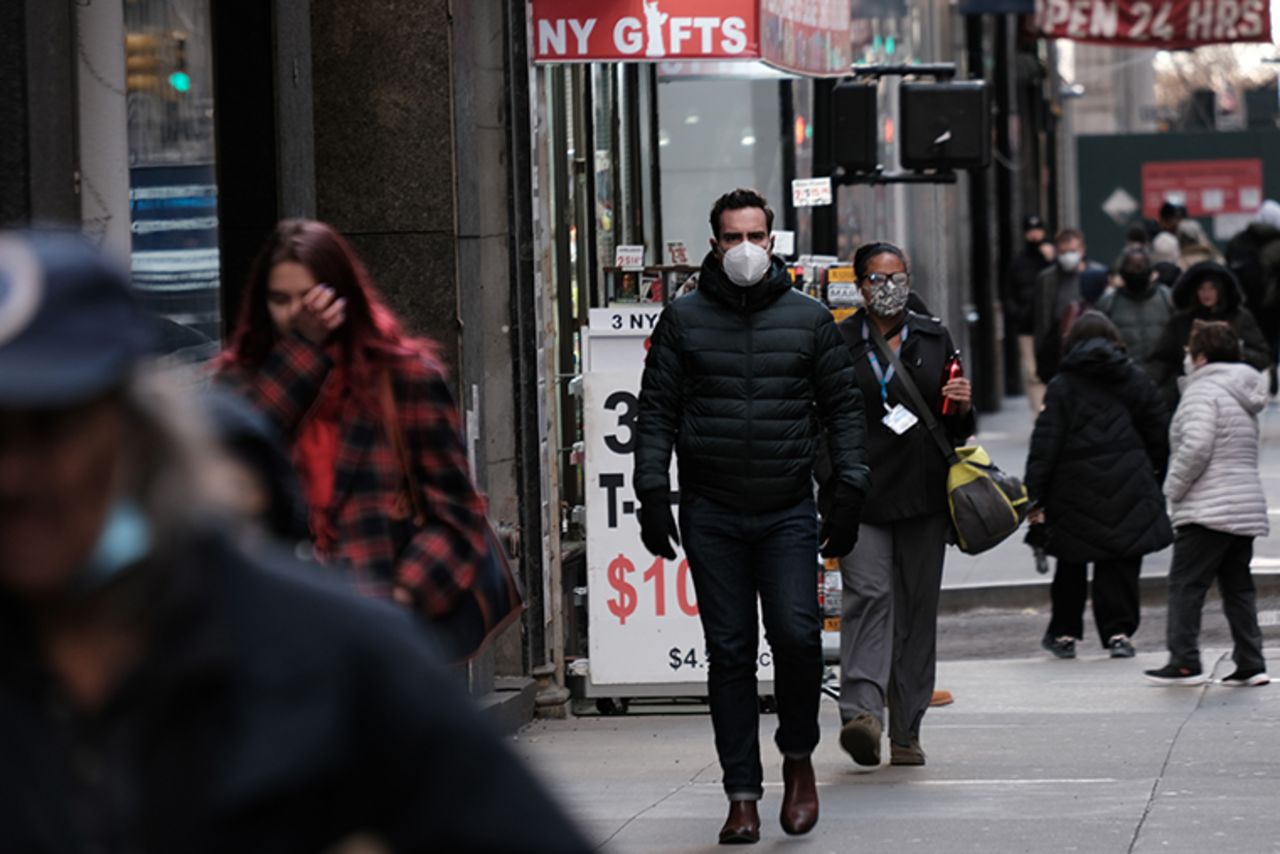 People wear face masks in Manhattan on November 29, 2021 in New York City.?