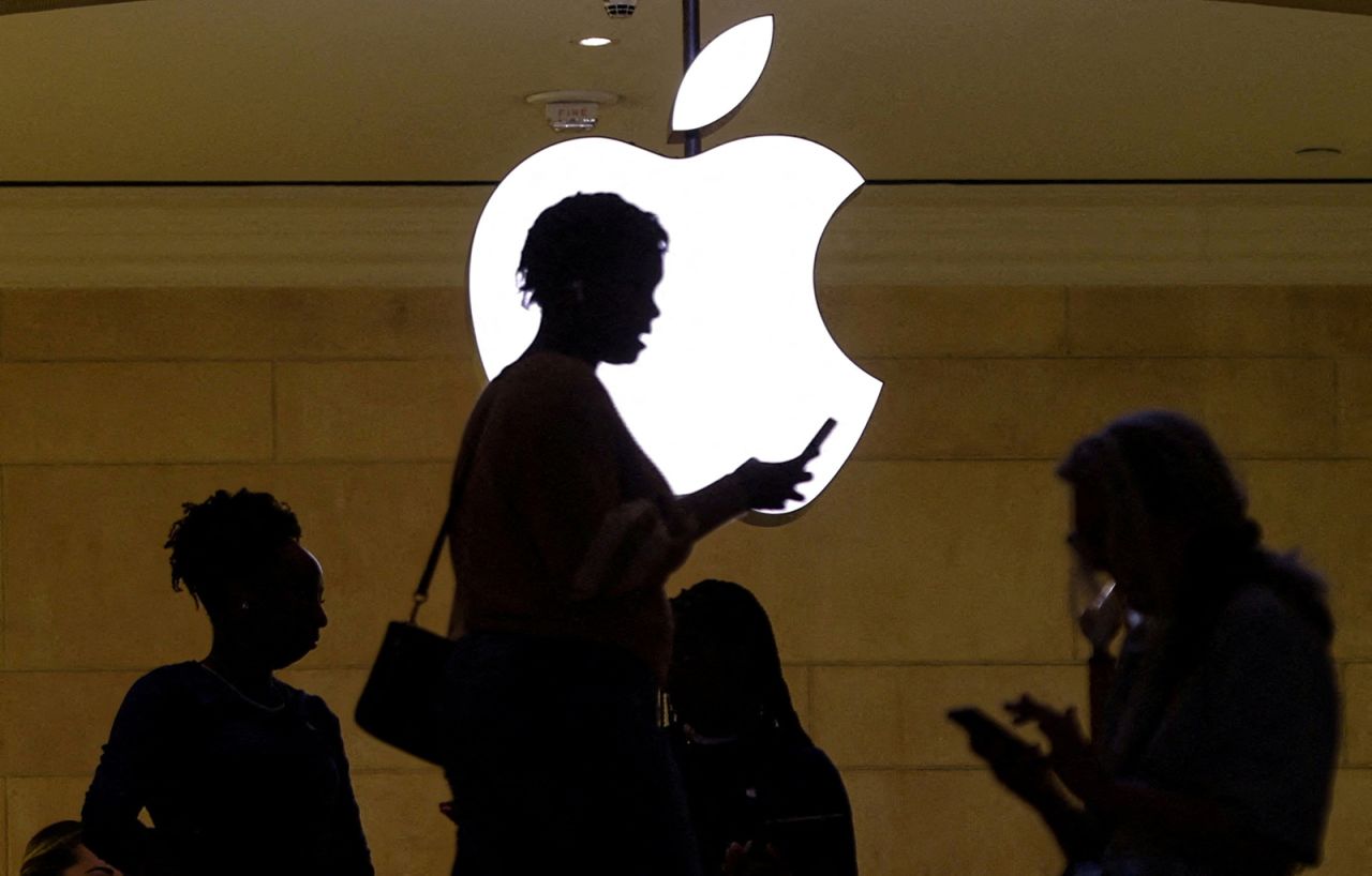 A woman uses an iPhone mobile device at the?Apple?store?at Grand Central Terminal in New York City, on April 14.