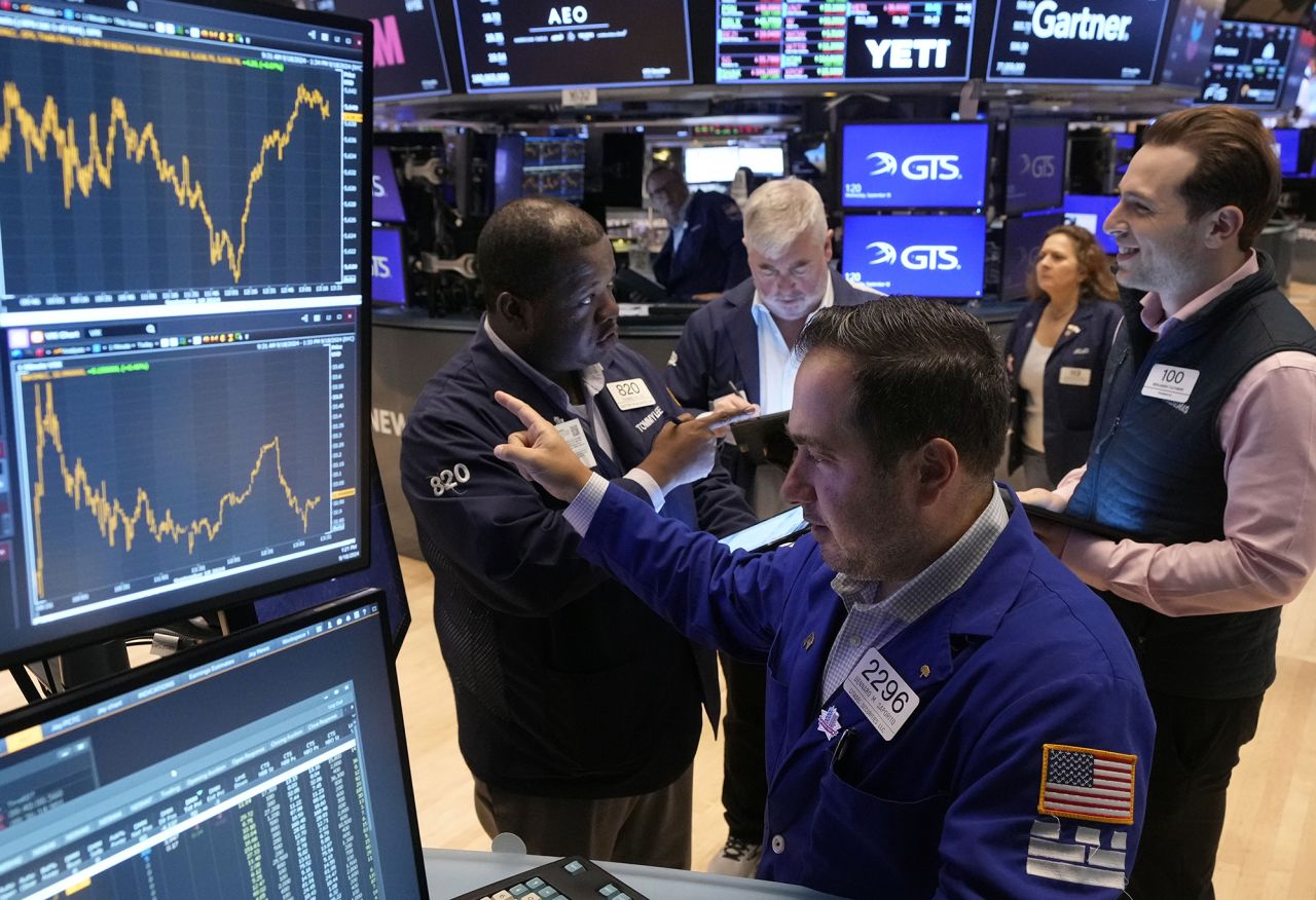 Traders work on the floor of the New York Stock Exchange on September 18.