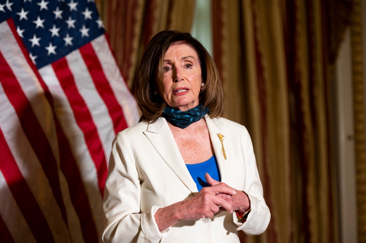 Speaker of the House Nancy Pelosi holds a bill enrollment photo opportunity for the Uyghur Human Rights Policy Act of 2020 in the Capitol on Tuesday, June 2.