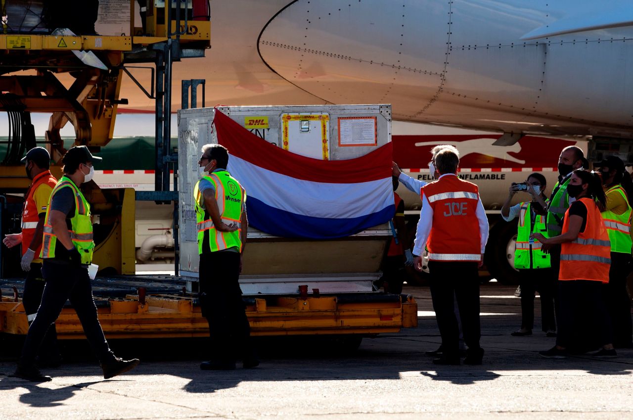 A batch of Russian Sputnik V coronavirus vaccines is unloaded from a plane at Silvio Pettirossi International Airport in Luque, Paraguay, on February 18. 