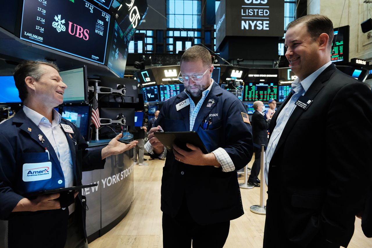 Traders work on the floor of the New York Stock Exchange (NYSE) at the start of trading on Monday following Friday’s steep decline in global stocks over fears of the new omicron Covid variant discovered in South Africa on November 29, 2021 in New York City. Stocks surged in morning trading as investors get more data on the new variant and reports that symptoms have so far been mild for those who have contracted it.?