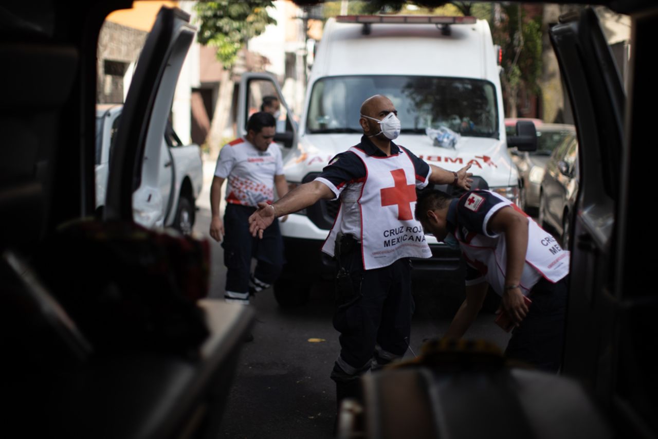 Oscar Espindola of the Mexican Red Cross is disinfected after responding to a probable Covid-19 call on June 19 in Mexico City.