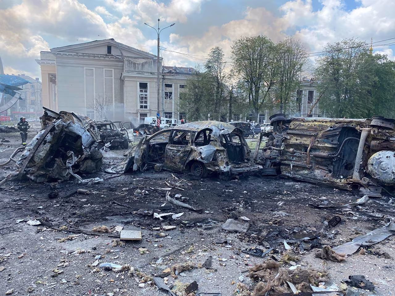 Damaged cars sit in the street following a missile strike in Vinnytsia, Ukraine, on Thursday, July 14. 
