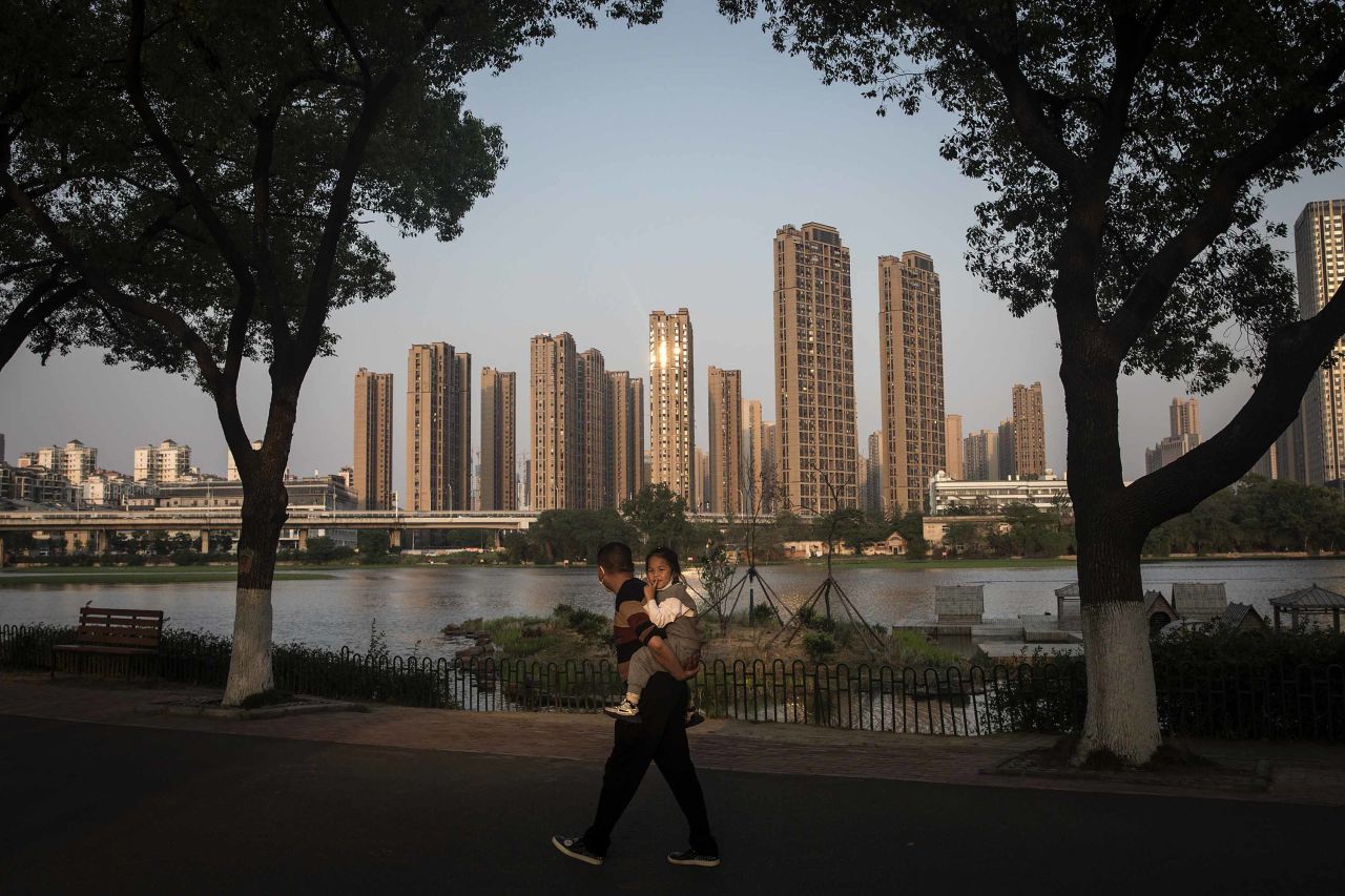 A man and a young girl visit Wuhan Zoo in China’s Hubei province on April 27, after the government started lifting travel restrictions in the region earlier in April.