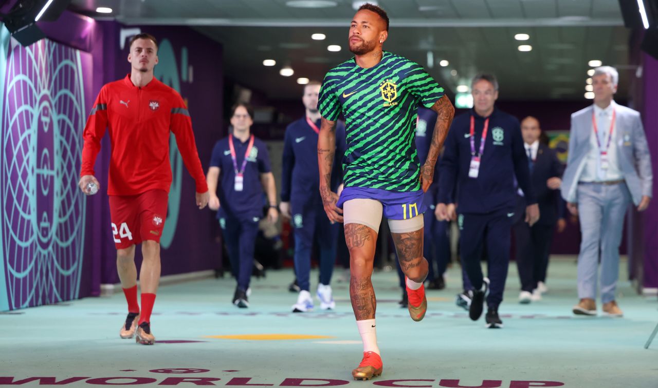 Brazilian star Neymar walks onto the pitch for warmups on Thursday.