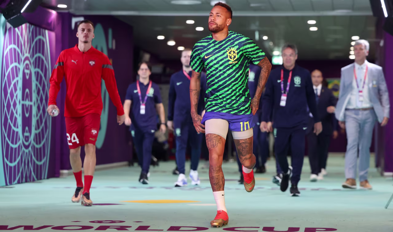 Brazilian star Neymar walks onto the pitch for warmups on Thursday.