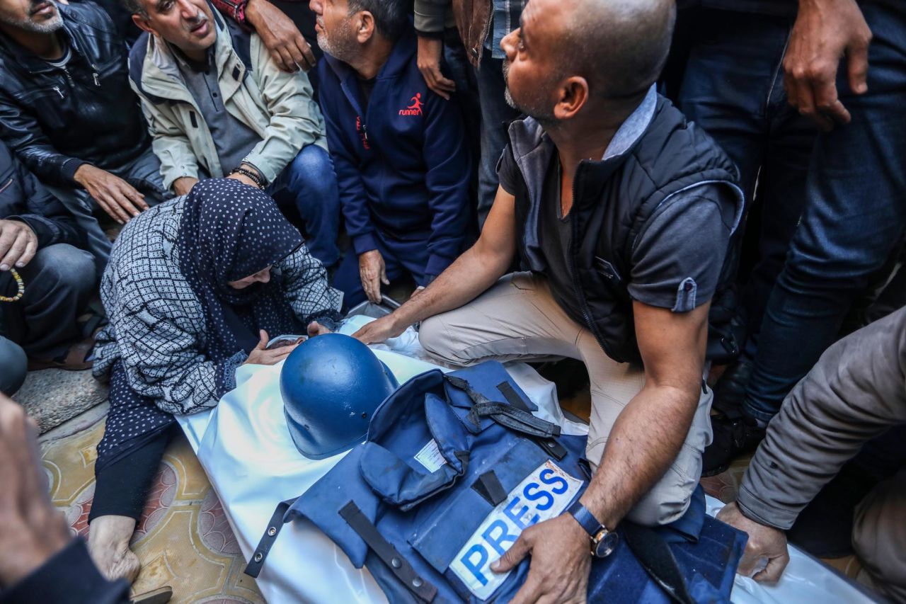 Relatives and friends mourn Al Jazeera cameraman Samer Abu Daqqa, who was killed while working in an air strike, on Saturday.