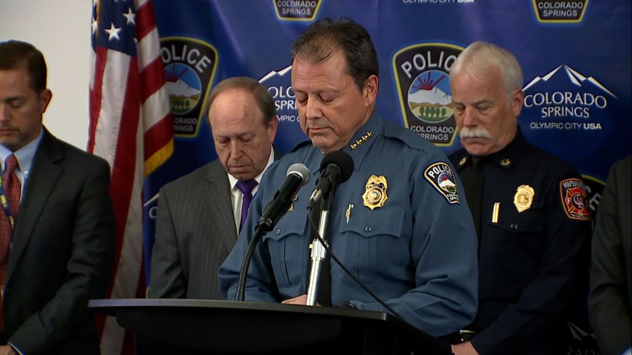 Colorado Springs Police Department Chief Adrian Vasquez holds a moment of silence during the press conference on Monday.