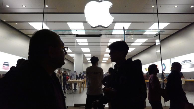 People walk by an Apple store in Glendale, California, on December 26.