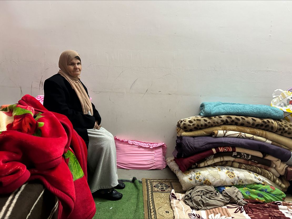 Fatima Tawfeeq is seen in a wedding hall that has been converted into a makeshift shelter in the nearby town of Kafr al-Labad.