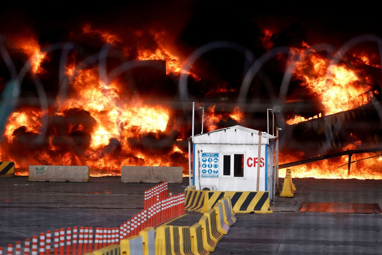 Containers at the port burn on Tuesday.