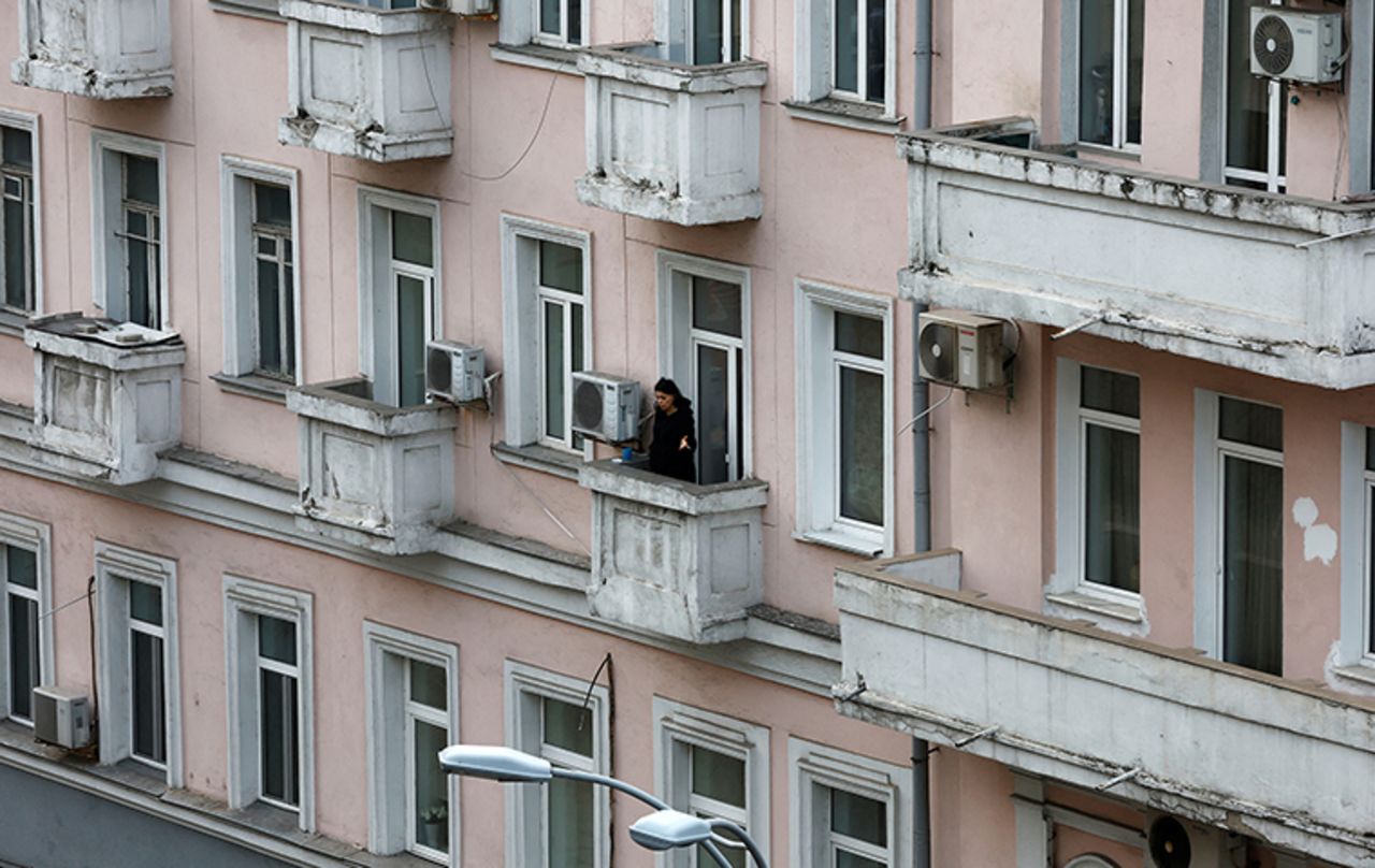 A person looks out of a building in Kyiv, Ukraine, on Saturday February 26.