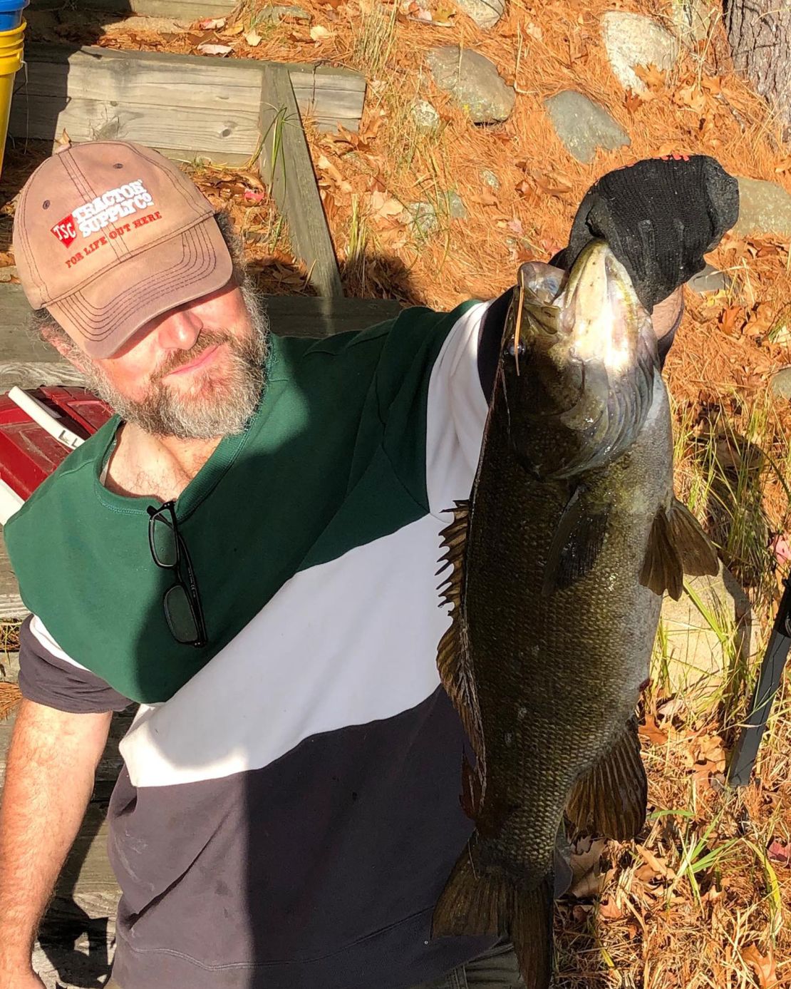 Perry shows off a his catch while wearing the hat from Tractor Supply