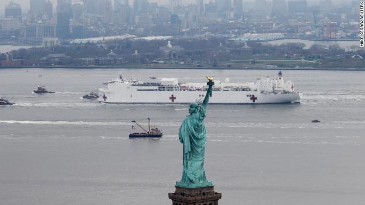 The USNS Comfort passes the Statue of Liberty as it enters New York Harbor during the outbreak of the coronavirus disease in New York City on March 30. 