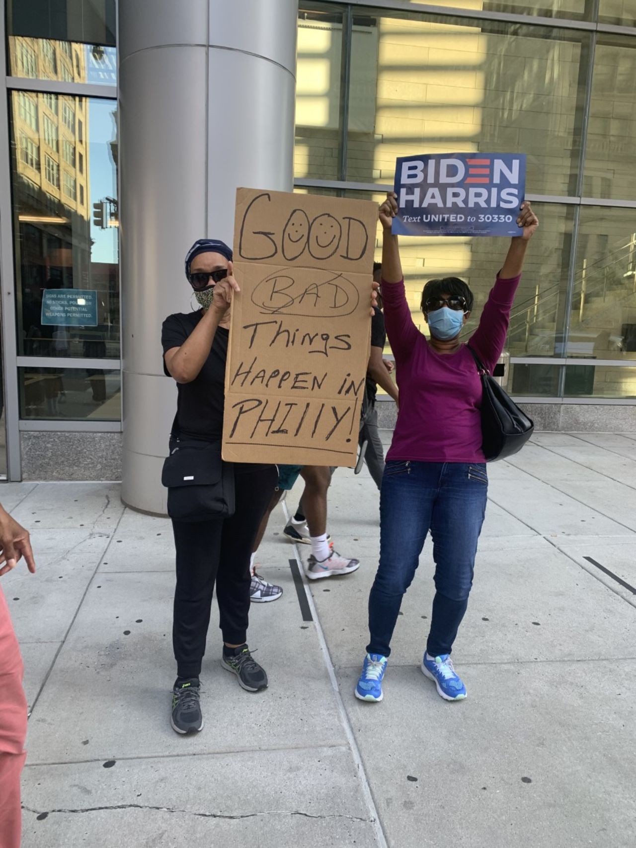 Sherry Viggs of Philadelphia (left) celebrates President-elect Joe Biden's projected win.