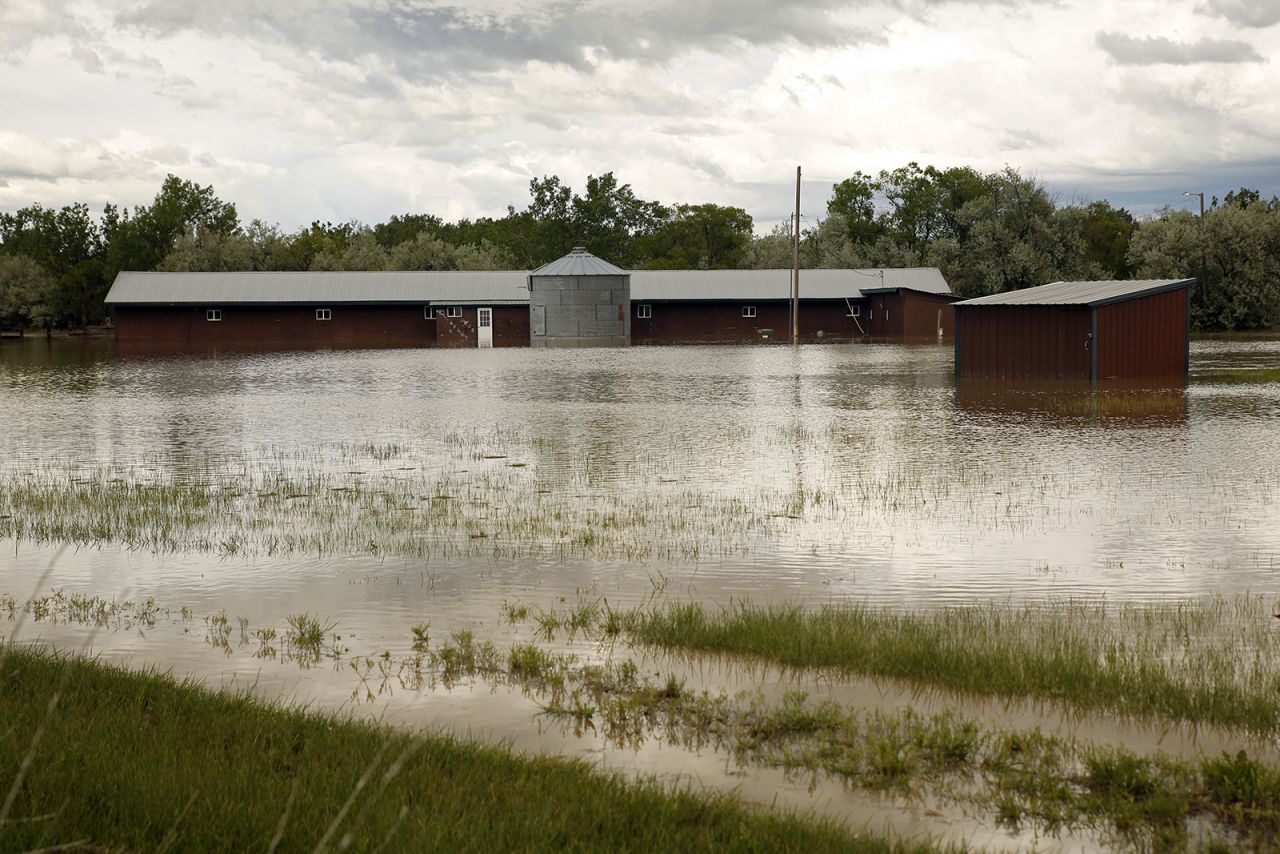 Floodwaters inundate property near the Clarks Fork Yellowstone River in between Edgar and Fromberg, Montana, on June 13.