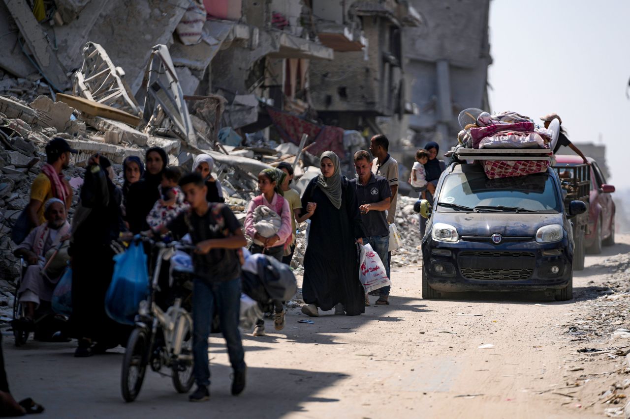 People flee from parts of Khan Younis on Monday following an evacuation order by the Israeli army.