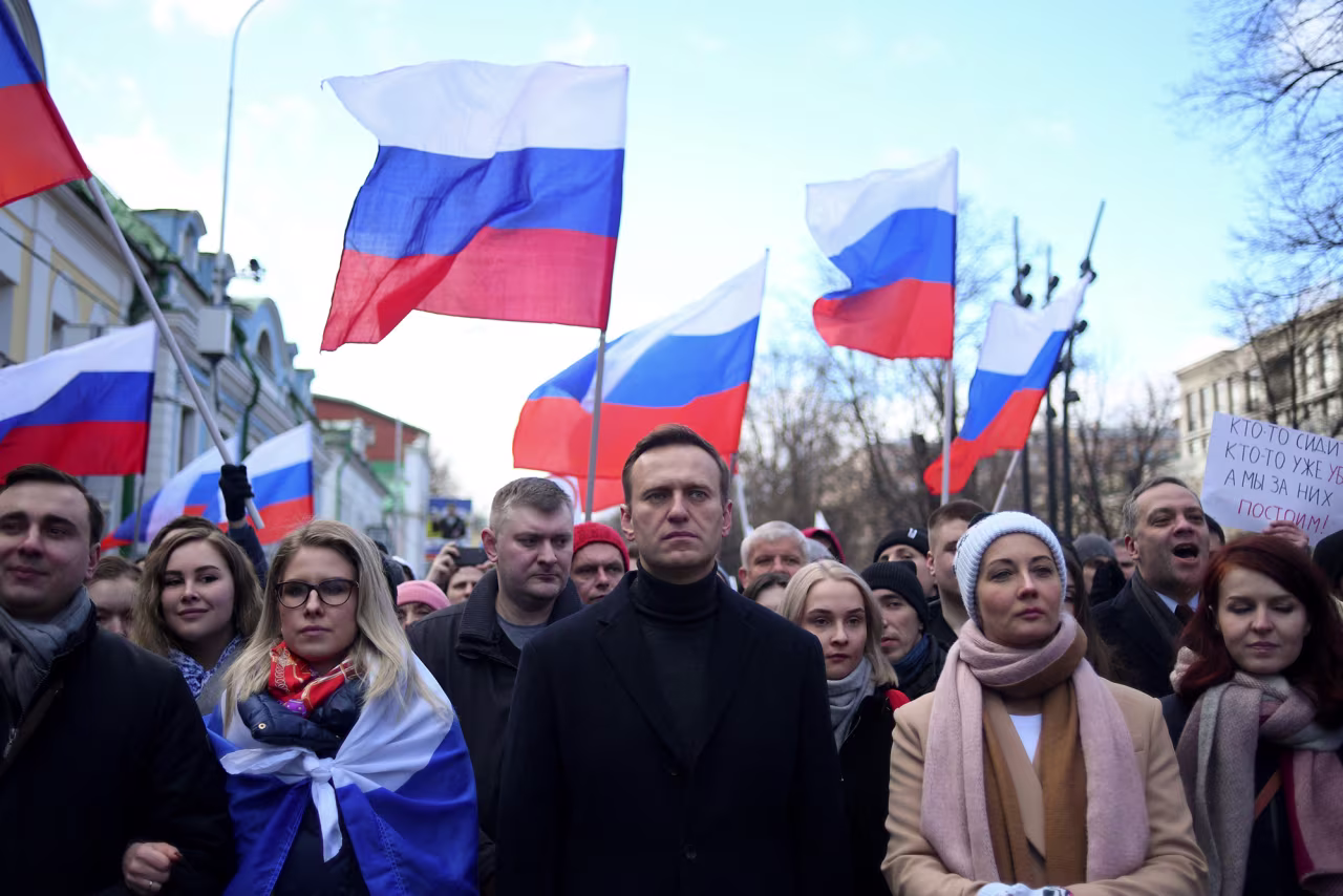 Alexey Navalny, his wife Yulia, and other demonstrators march in downtown Moscow on February 29, 2020.