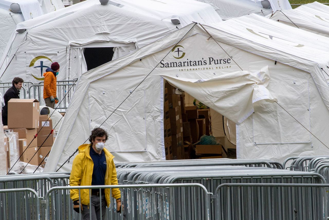 Workers build a field hospital in Central Park on Tuesday, March 31.