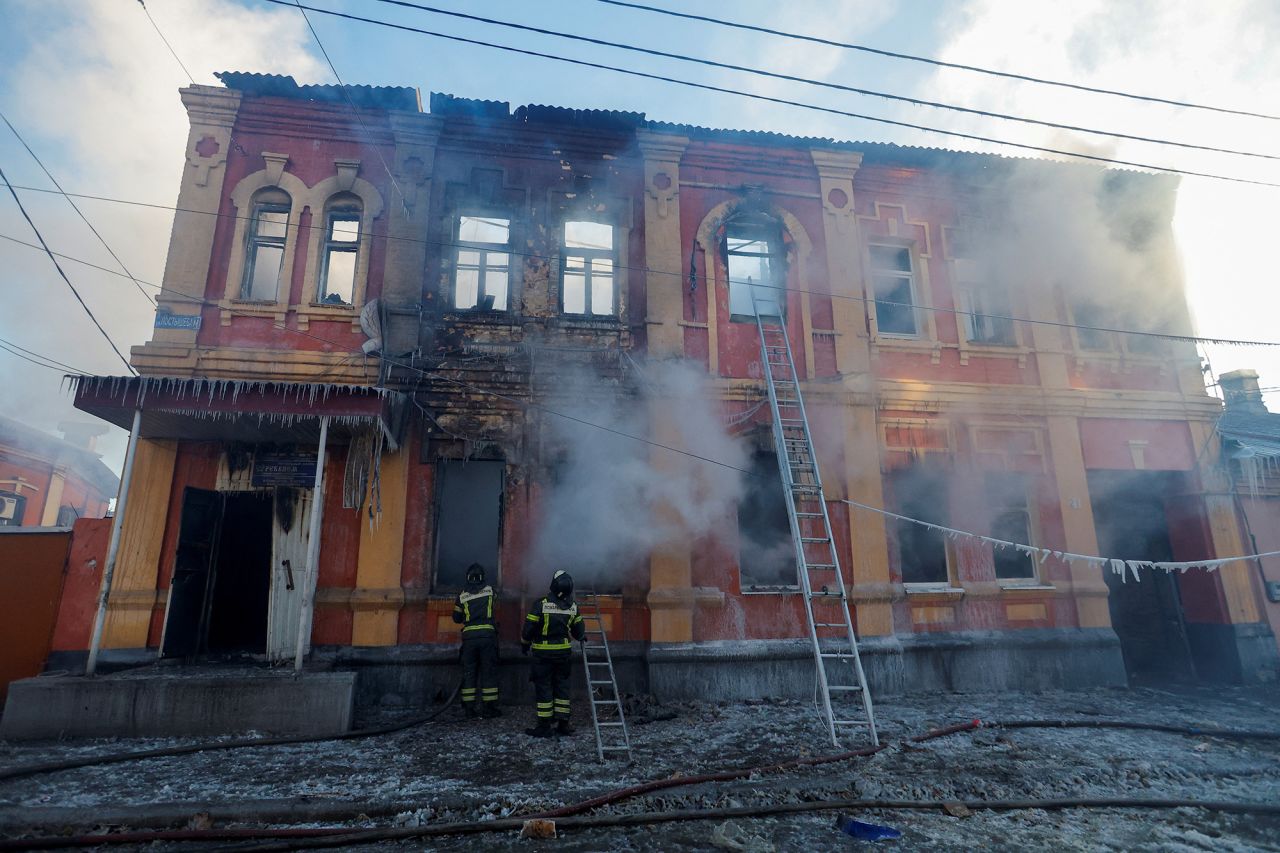 Firefighters work outside an office building destroyed in shelling in Donetsk,?Ukraine, on?December 5.