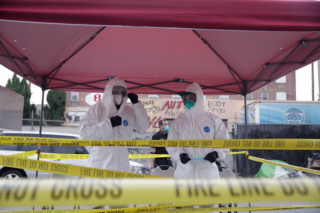 Members of the Los Angele Fire Department prepare to test patients at testing site in Los Angeles on April 20.