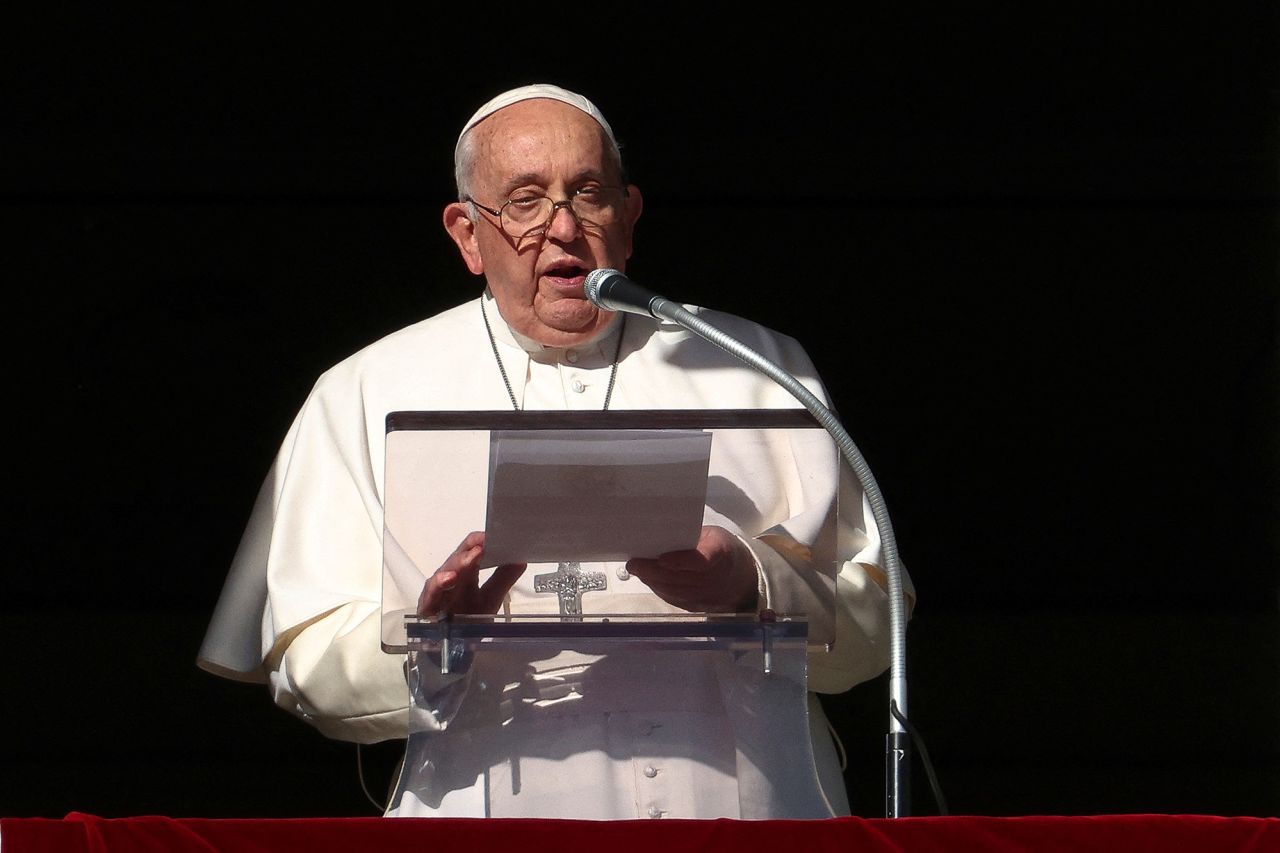 Pope Francis leads the Angelus prayer from his window at the Vatican, on December 17. 