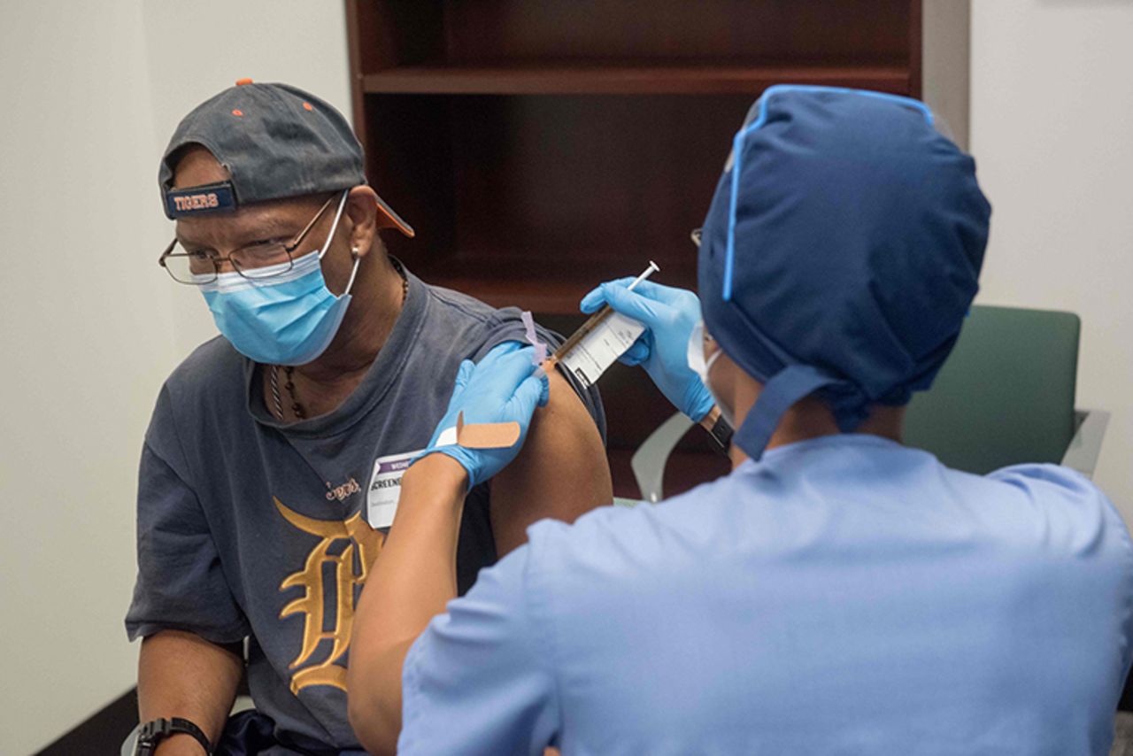 In this image courtesy of the Henry Ford Health System, volunteers are given the Moderna mRNA-1273 Coronavirus Efficacy (COVE), on August 5, 2020, in Detroit, Michigan. The first COVID-19 vaccine trial volunteers in Michigan received their first shots August 5, in an effort to help find a safe, effective vaccine to the deadly coronavirus.